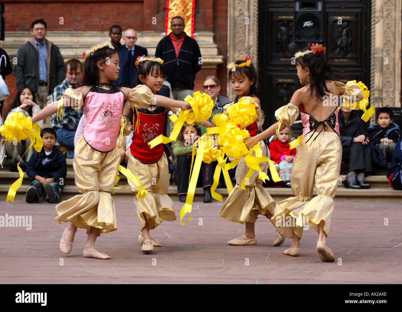 Young Chinese dancers performing in front of large audience at the Chinese Mid-Autumn Festival, V&A Museum, London, 8th October 2006 Stock Photo