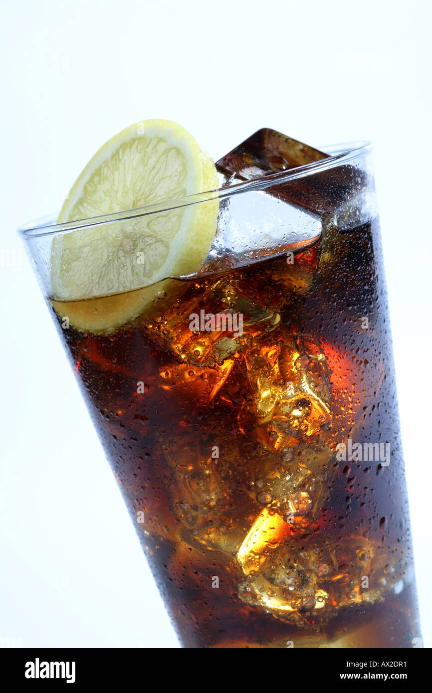 Cola soft drink in a tall glass with ice cubes and lemon slice Stock ...
