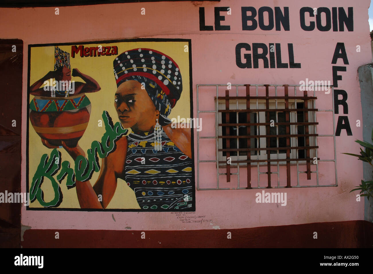 Modern African art on a shop wall The Gambia West Africa. Advertising the retail sector that the shop belongs to. Stock Photo