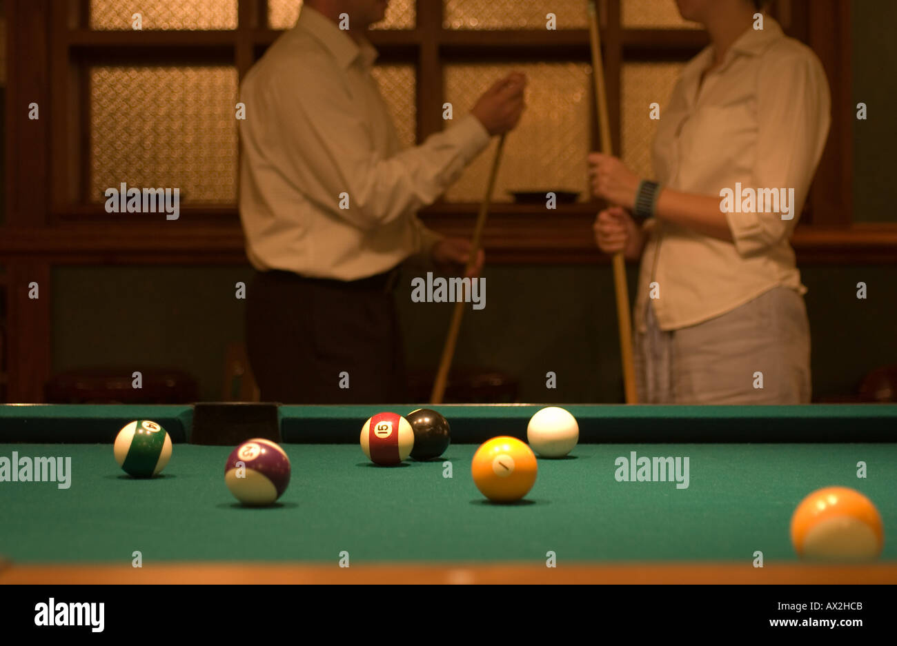 couple by pool table Stock Photo