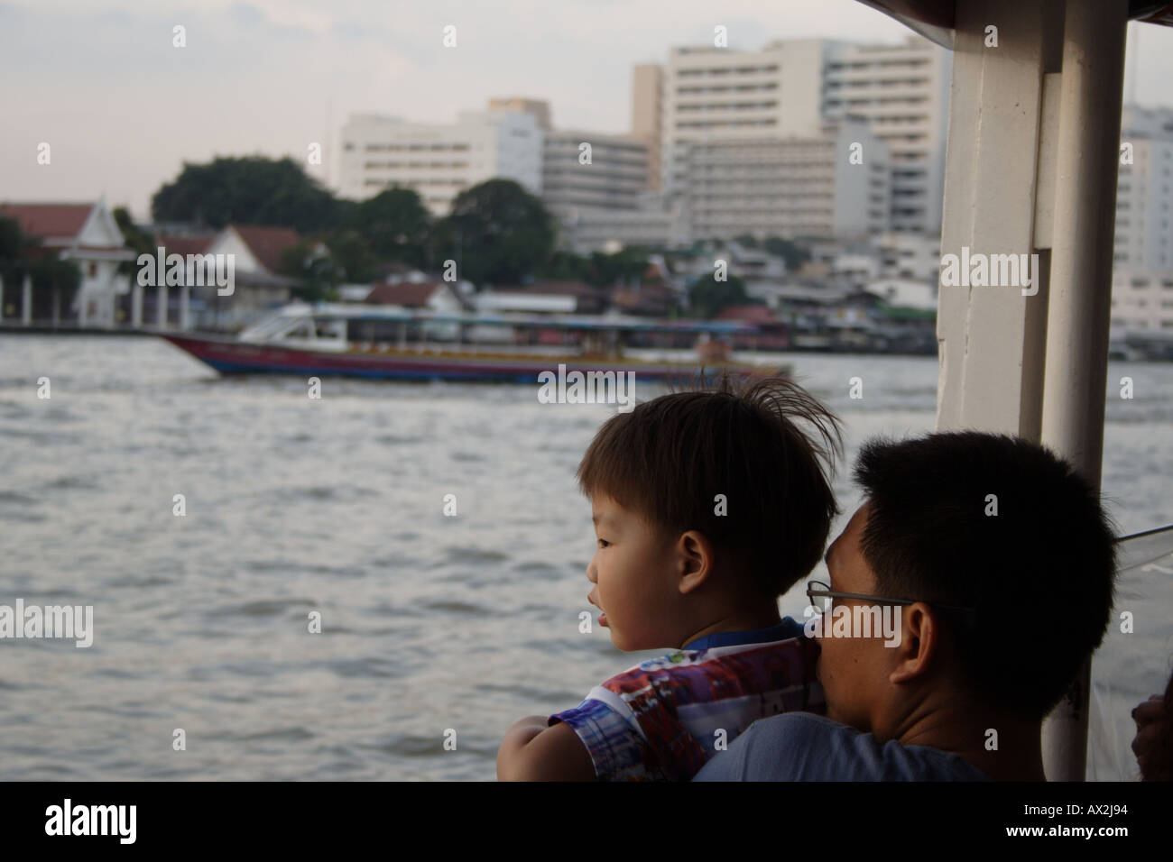 Father and son on the Chao Phraya River, Bankok, Thailand Stock Photo