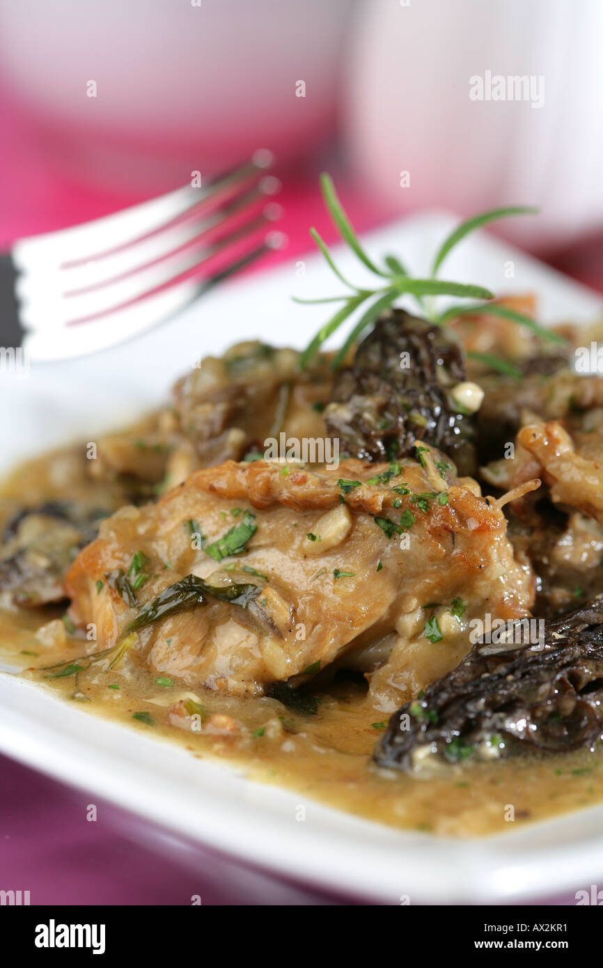 Rabbit with morels wild mushrooms Stock Photo - Alamy
