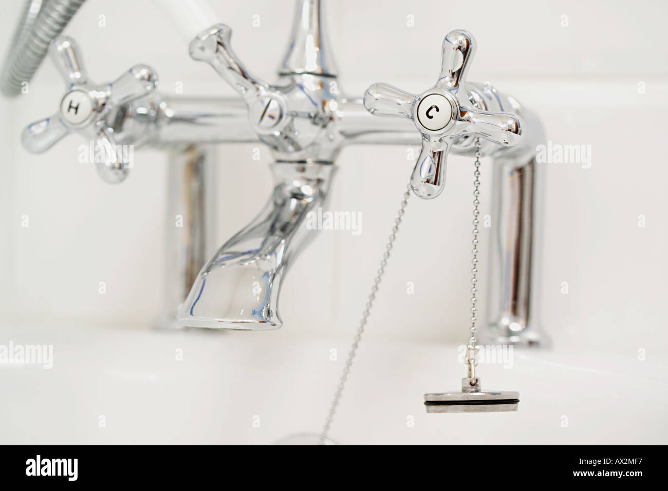 shiny bath taps and plug Stock Photo Alamy