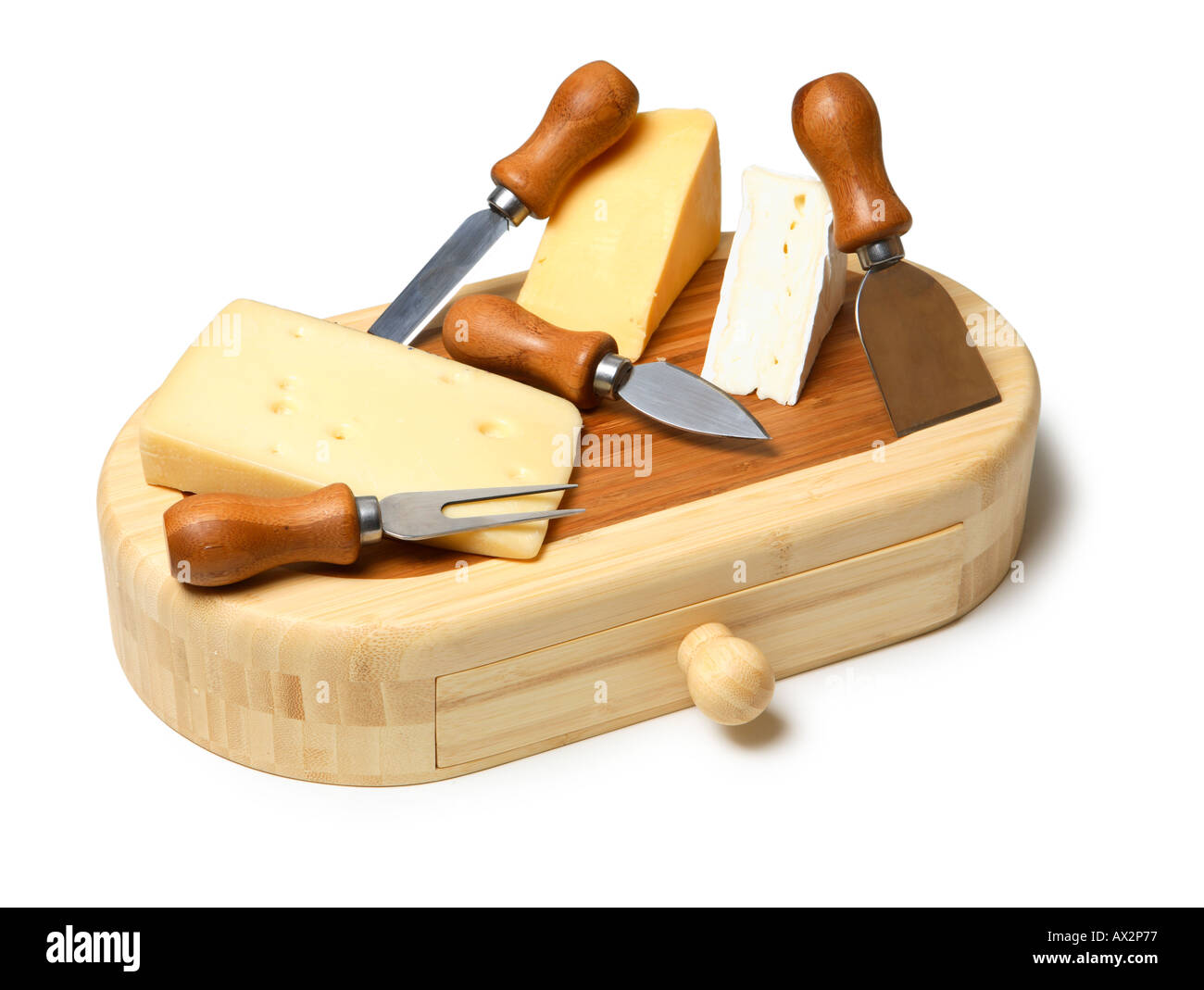 Cheeses on cutting board Stock Photo