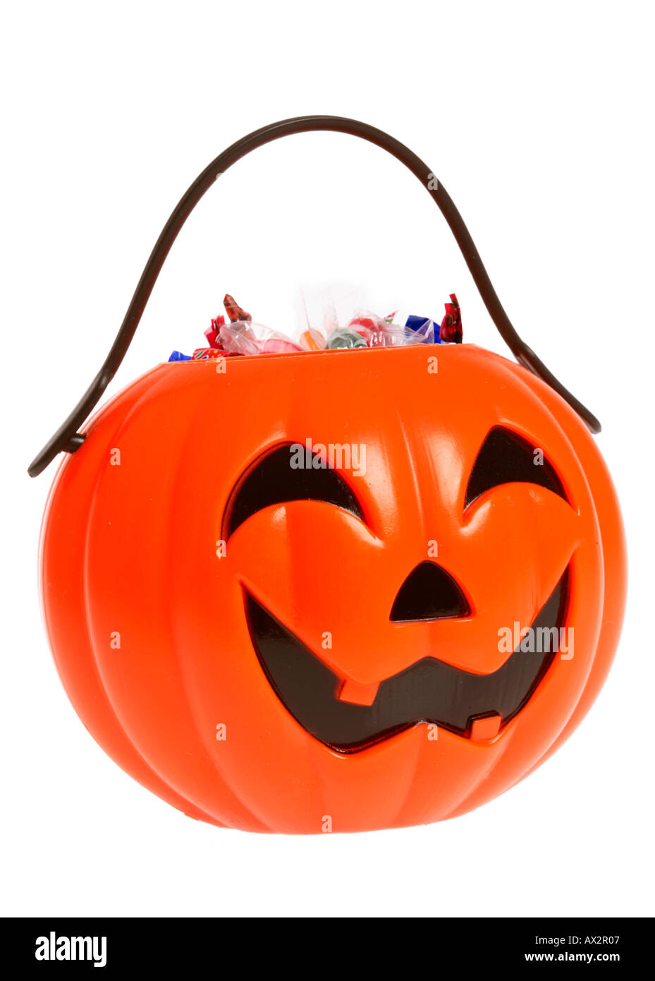 Halloween plastic JackoLantern full of candy Stock Photo Alamy