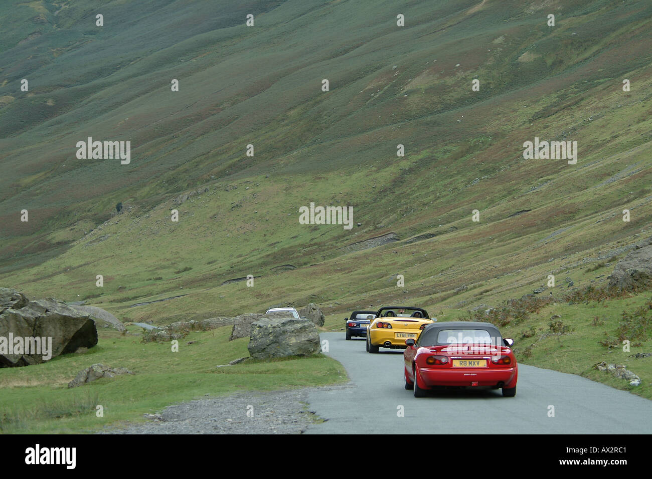 Sports cars decending Honister Pass, the Lake District, Cumbria, England Stock Photo