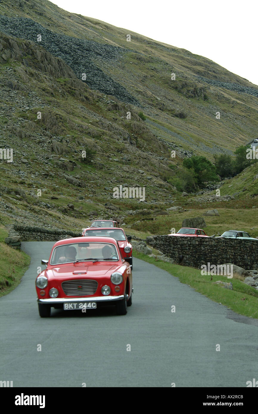 Classic cars decending Honister Pass, the Lake District, Cumbria, England Stock Photo