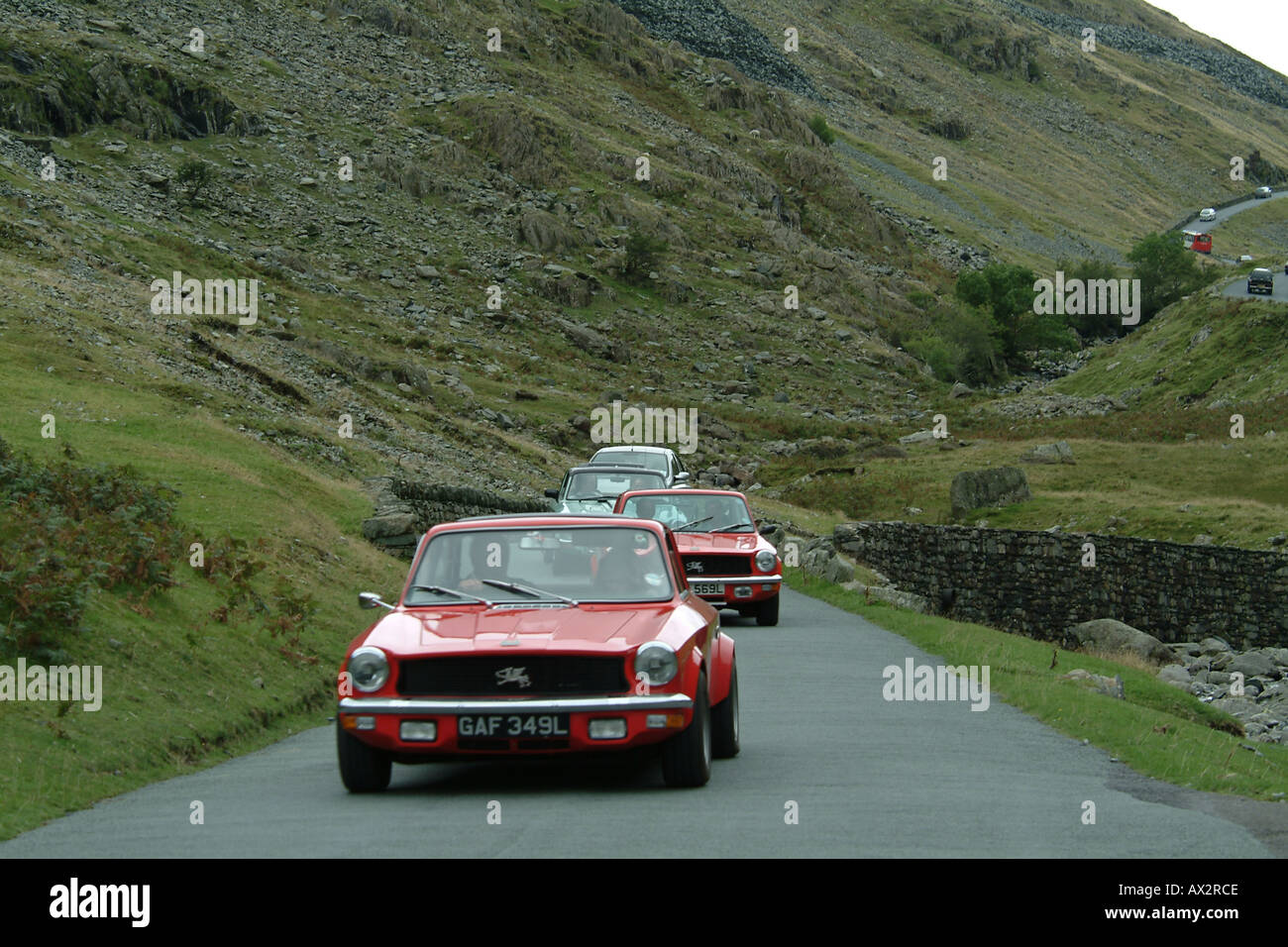 Classic cars decending Honister Pass, the Lake District, Cumbria, England Stock Photo