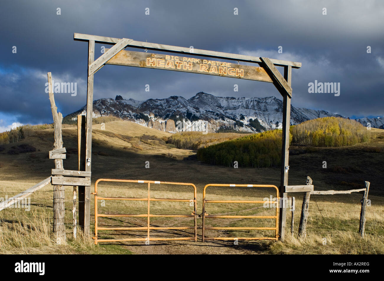 Heath Ranch Autumn Aspen Trees and Snow Covered Mountains San Miguel County Colorado Stock Photo