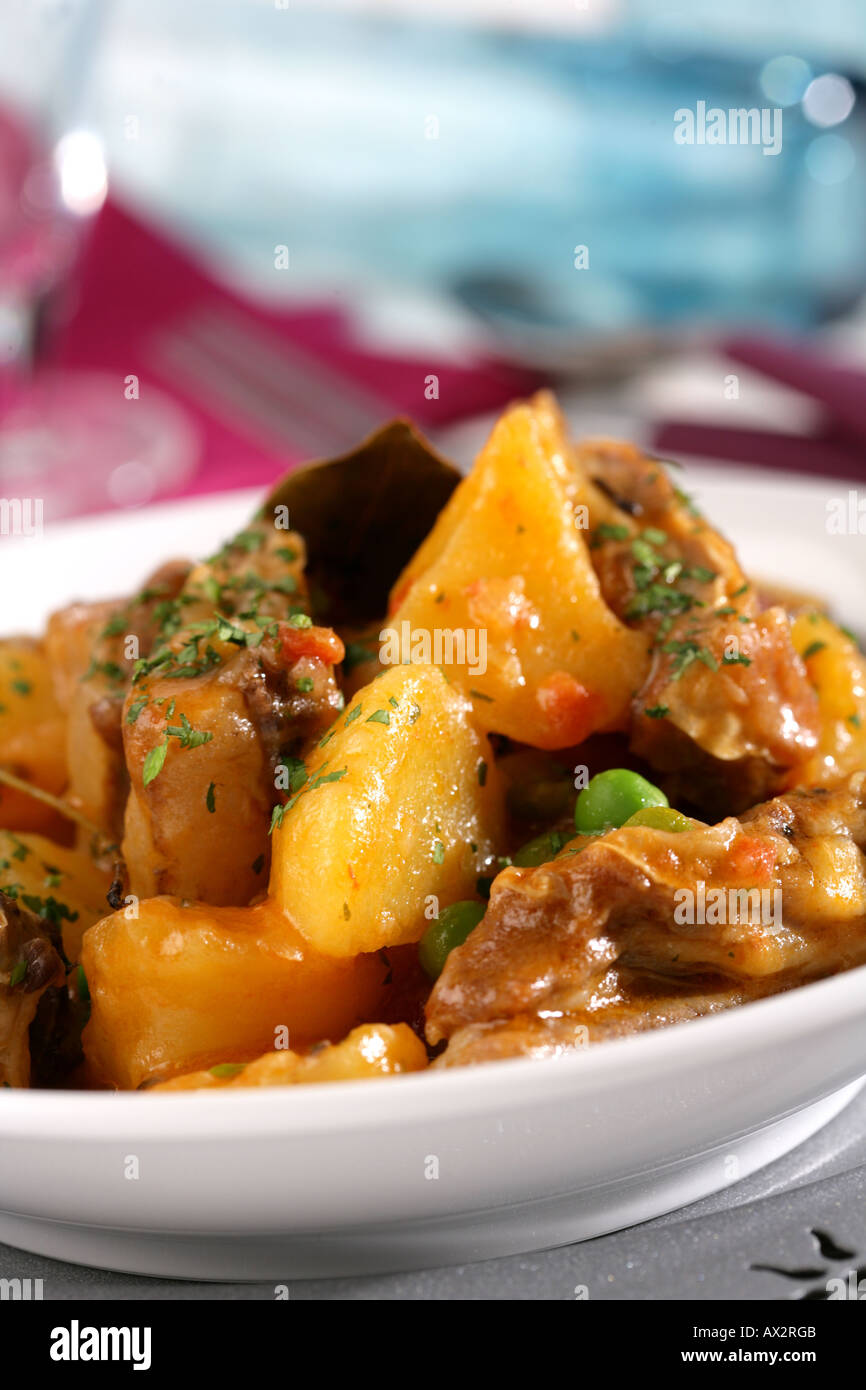 Lamb with potatoes and peas Stock Photo - Alamy