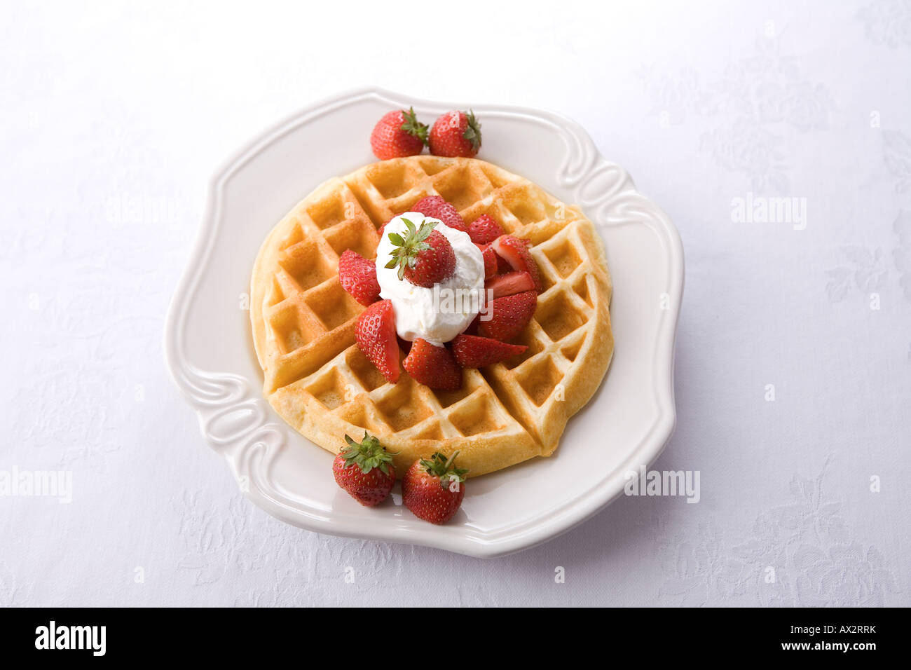 Strawberry Waffle with Maple Syrup & Whipped Cream Stock Photo - Alamy
