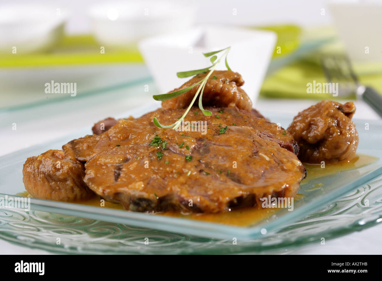 Veal knuckle with dried figs Stock Photo Alamy