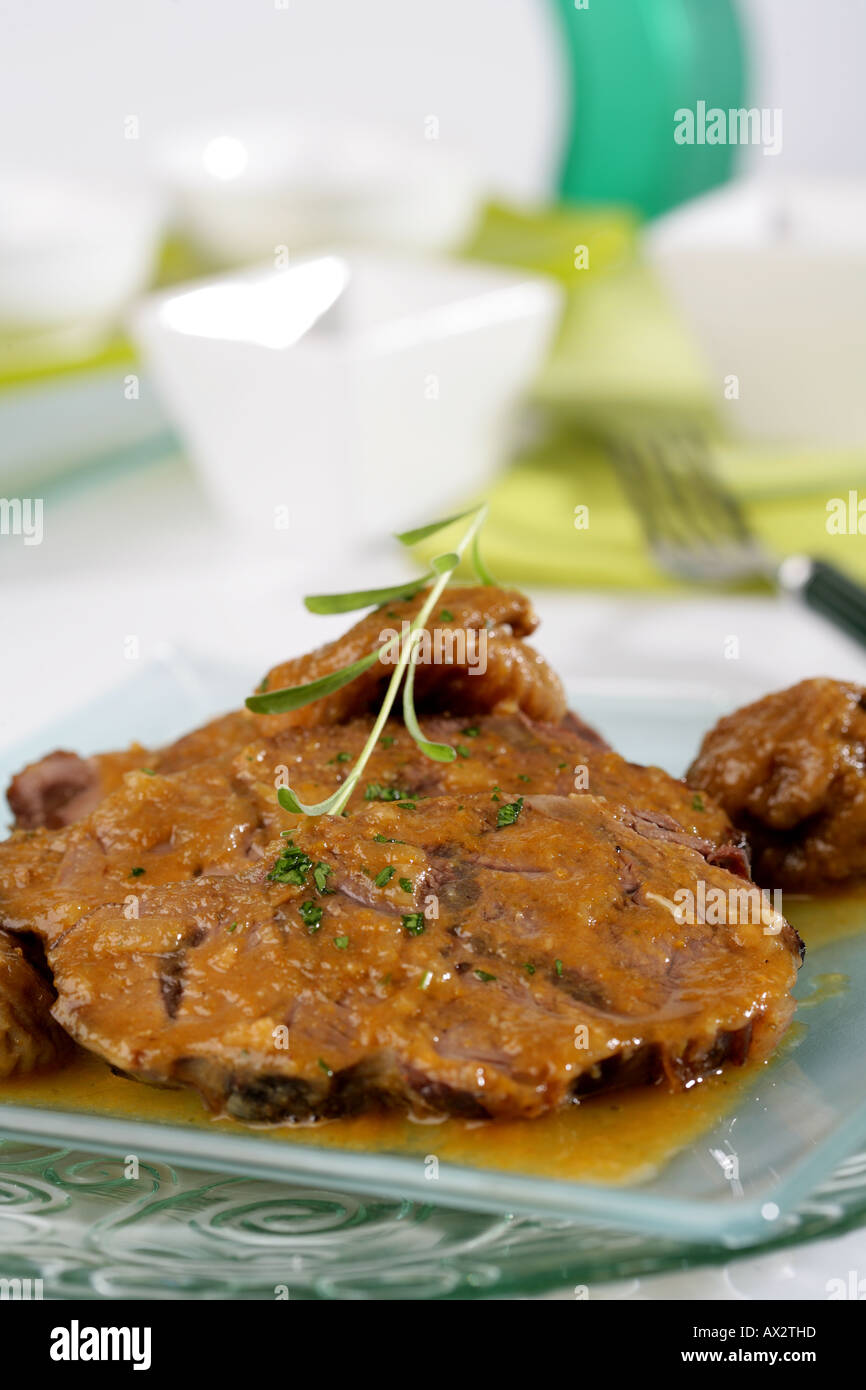 Veal knuckle with dried figs Stock Photo Alamy