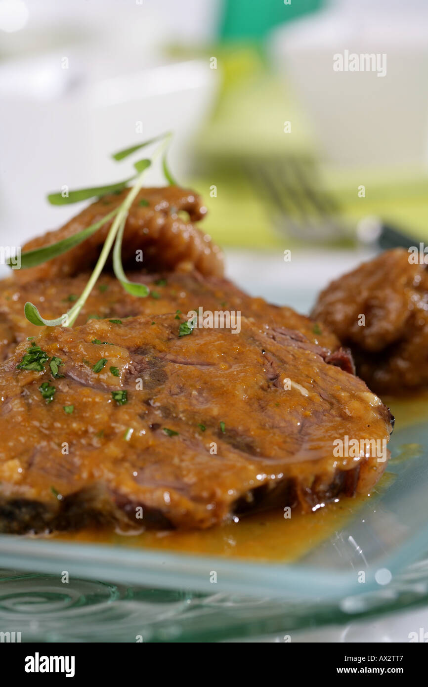 Veal knuckle with dried figs Stock Photo Alamy