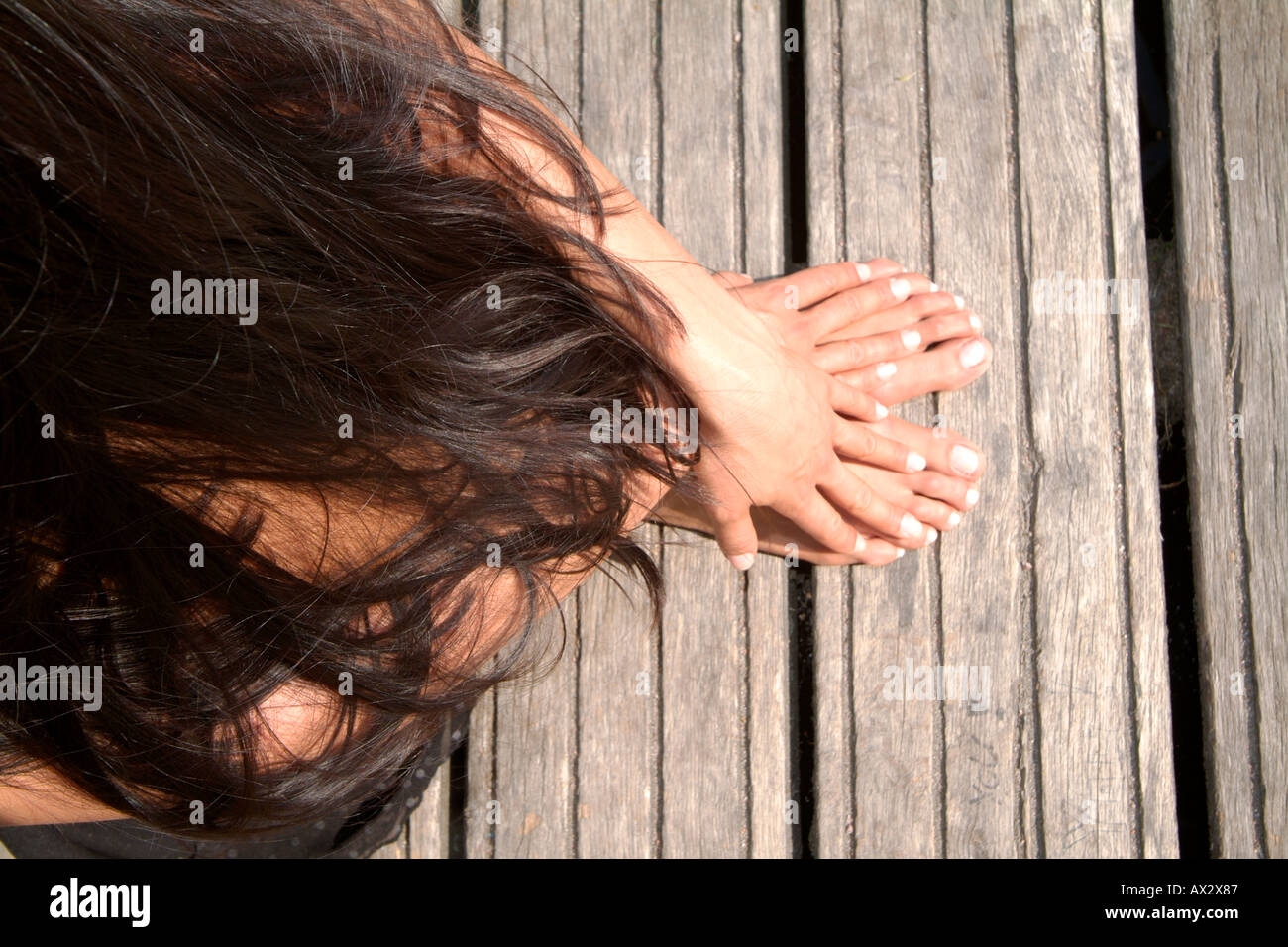 Body Soul young girl relaxing Hamburg Summer wood hair fingers hands Stock Photo