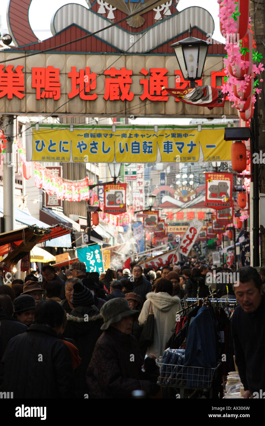 Shoppers and traders on a busy Jizo Dori street in Sugamo in Tokyo Japan Stock Photo