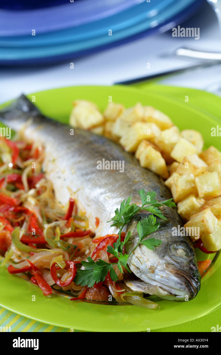 Baked seabass with potatoes and vegetables Stock Photo - Alamy