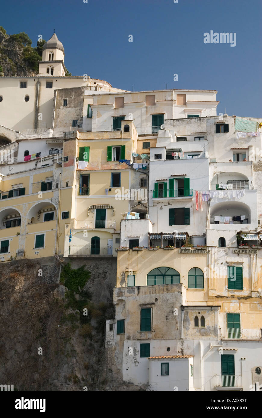 Buildings tower one on top of another up the steep cliffs in Amalfi Town, Campania, Italy Stock Photo