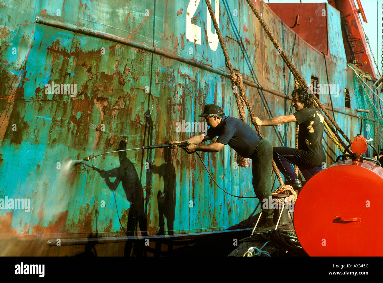 Cleaning Rusty Ship Hull Prep for Paint - Lunenburg - Nova Scotia - Canada Stock Photo