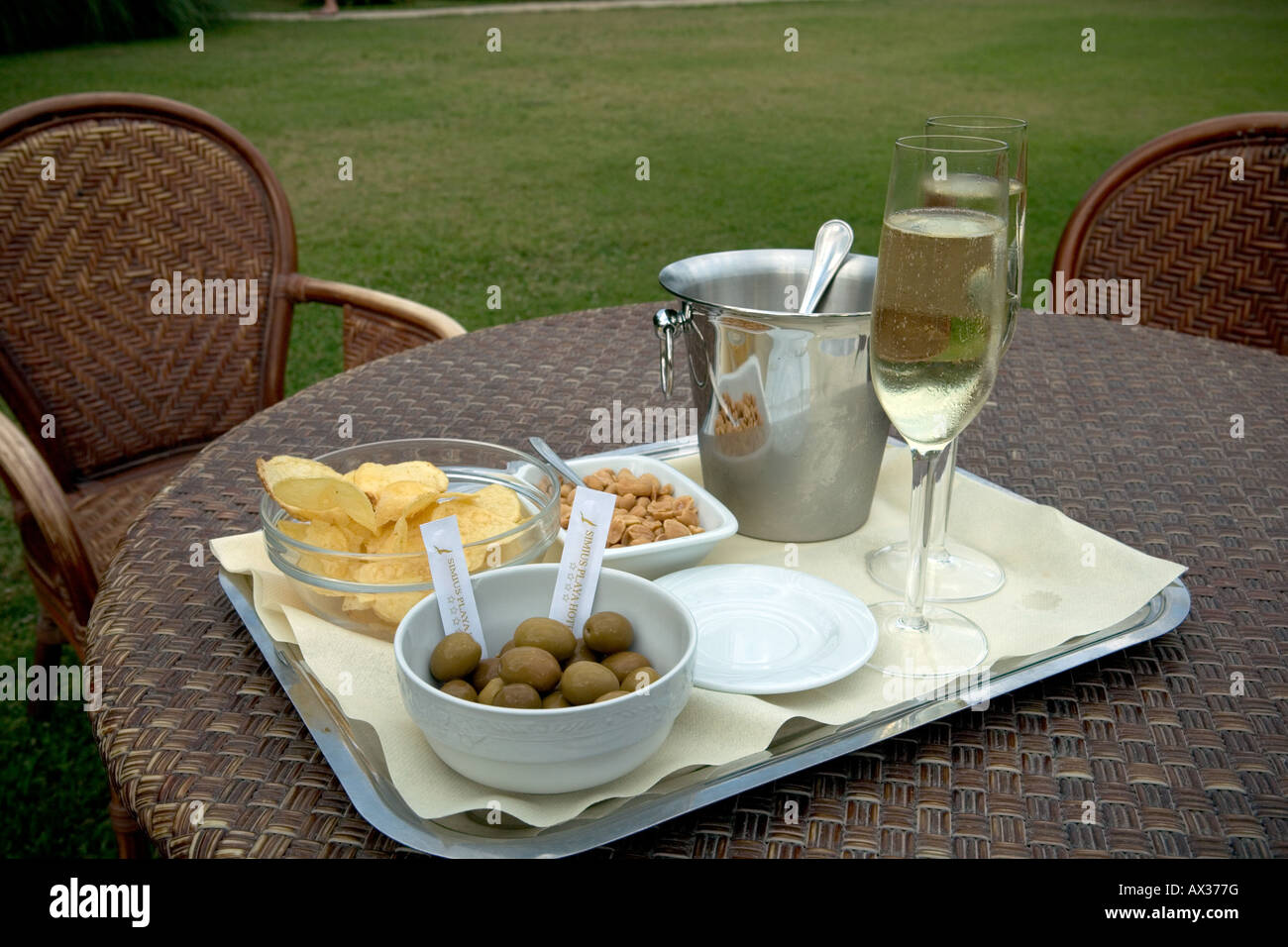 prosecco and olives in a garden Stock Photo