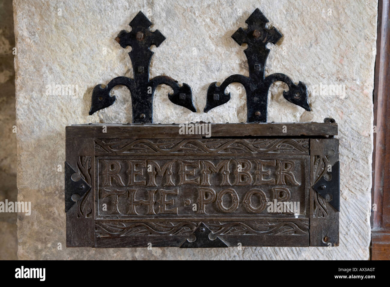 Historic rare wall-mounted alms box close-up (raise collect money for poor relief) - inside St. Mary's Church, Conistone, Yorkshire Dales, England UK. Stock Photo