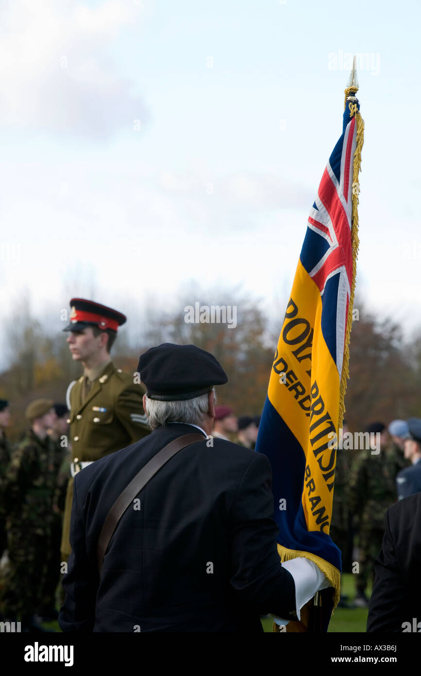 Royal British Legion standard bearer & soldier in military uniform ...