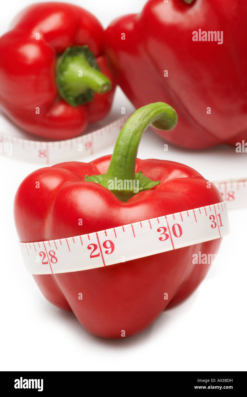 Red Pepper with tape measure indicating weight loss Stock Photo Alamy