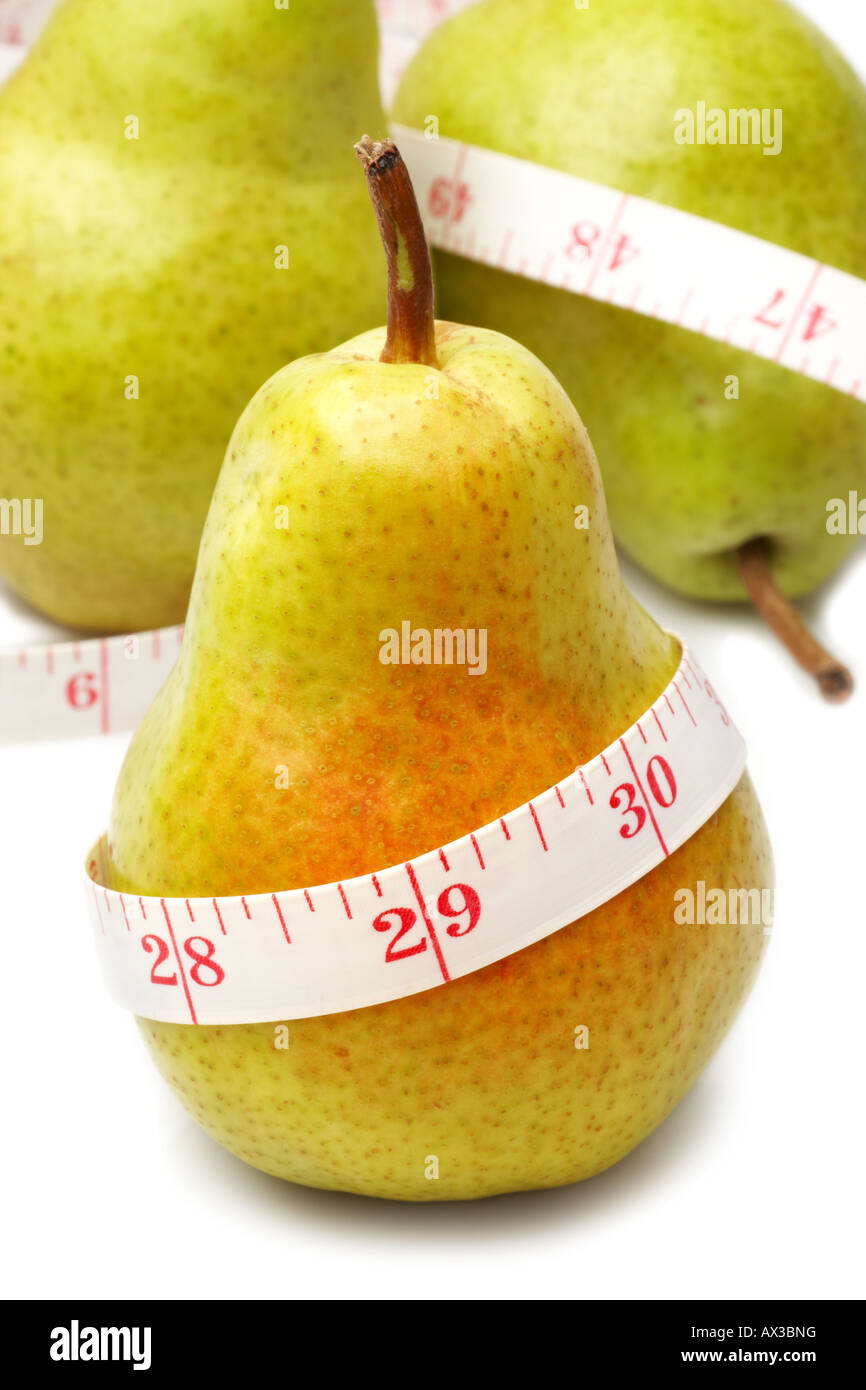 Pear fruit with tape measure indicating weight loss Stock Photo Alamy