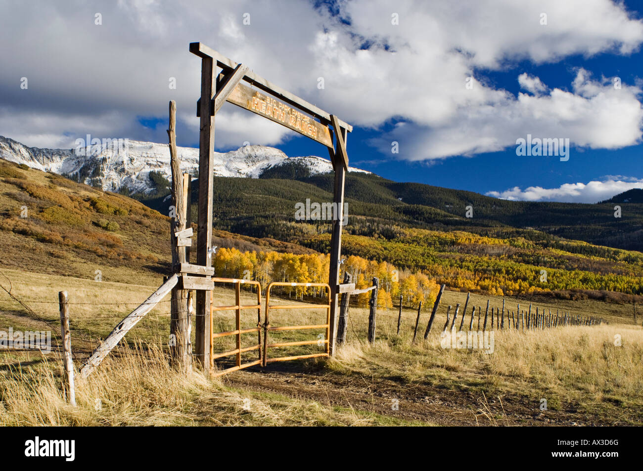 Heath Ranch Autumn Aspen Trees and Snow Covered Mountains San Miguel County Colorado Stock Photo