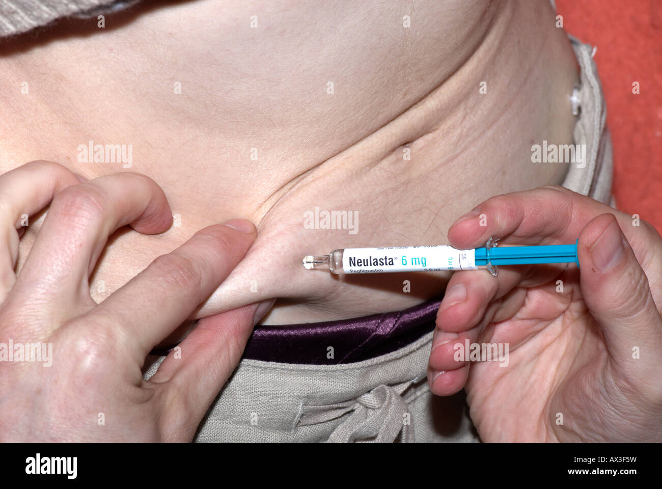 Giving an injection in tummy with Neulasta after chemotherapy Stock ...