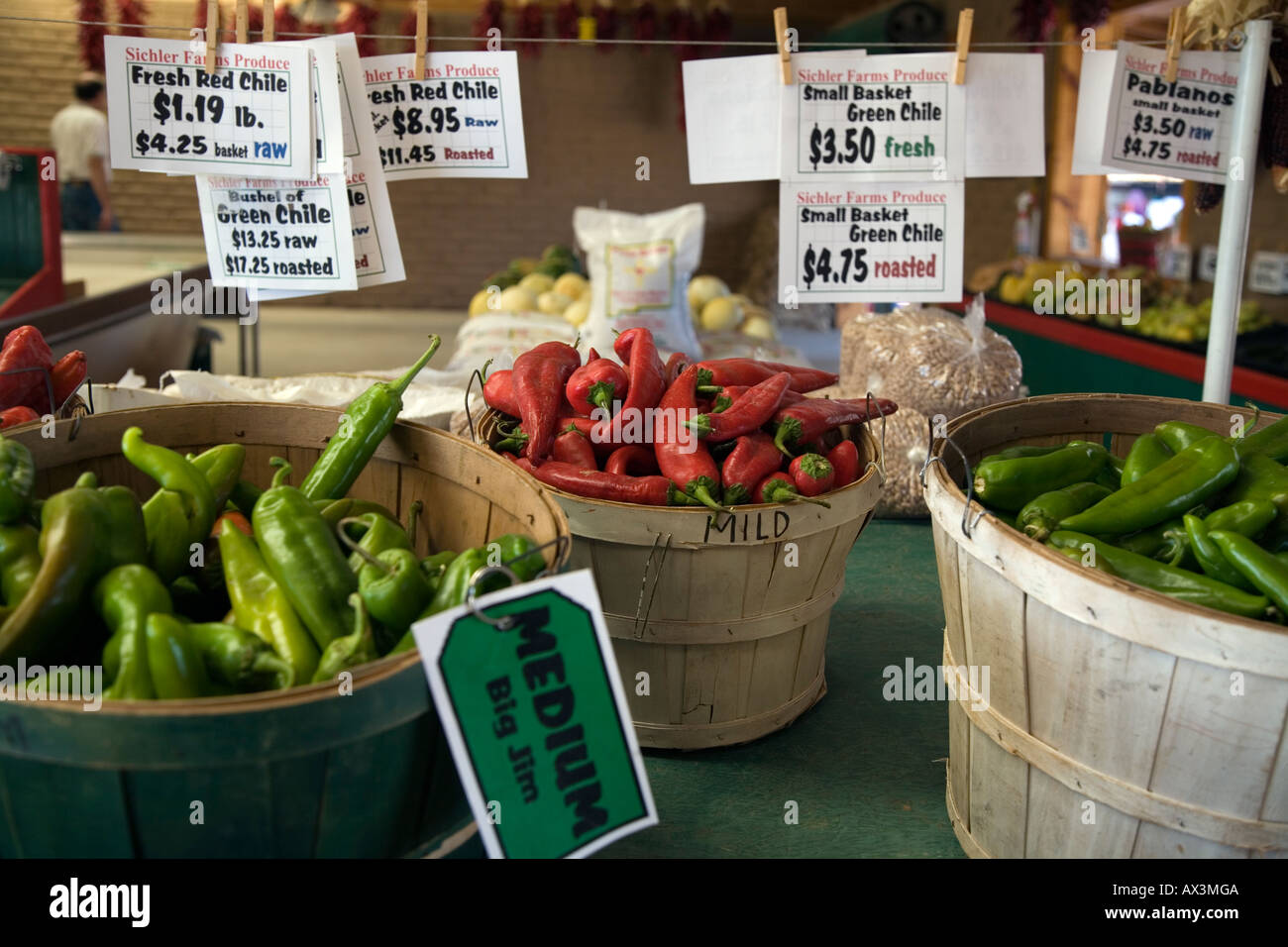 Baskets of New Mexico red and green chile peppers on display for sale