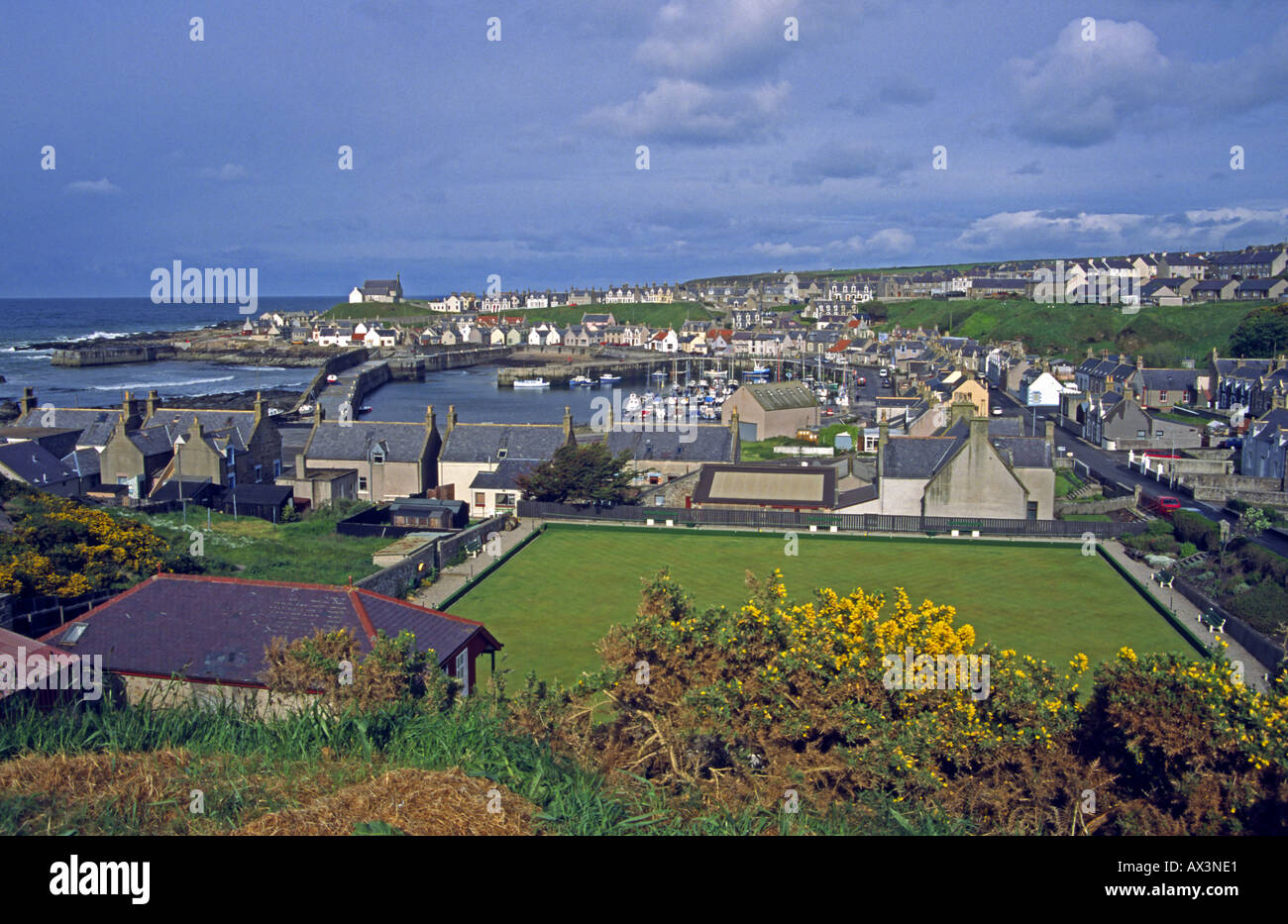 Findochty town and harbour area in Findochty Moray Scotland with bowling green in the foreground. Stock Photo