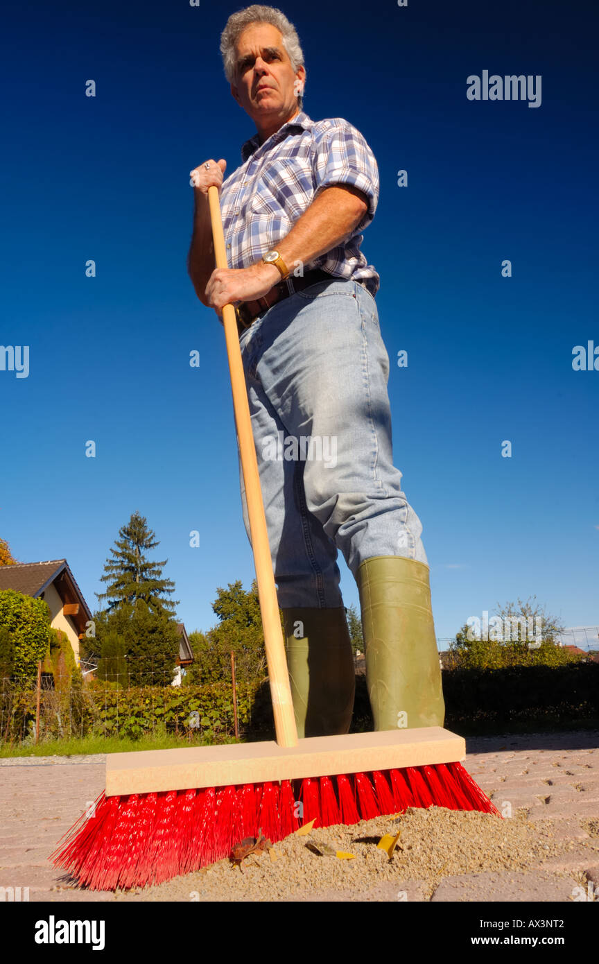 A new broom sweeps clean Stock Photo - Alamy