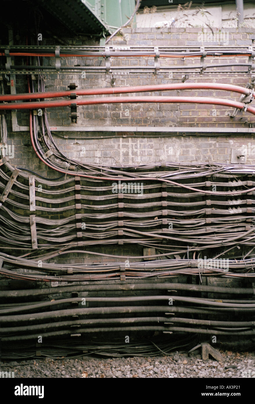 Cables attached to brick wall Stock Photo Alamy