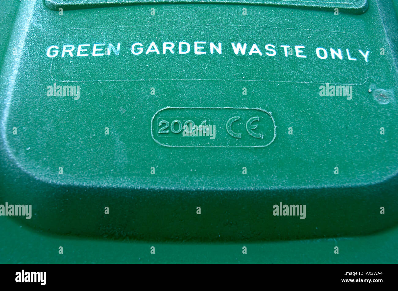 A green recycling bin for the depositing of garden waste to await collection Stock Photo Alamy
