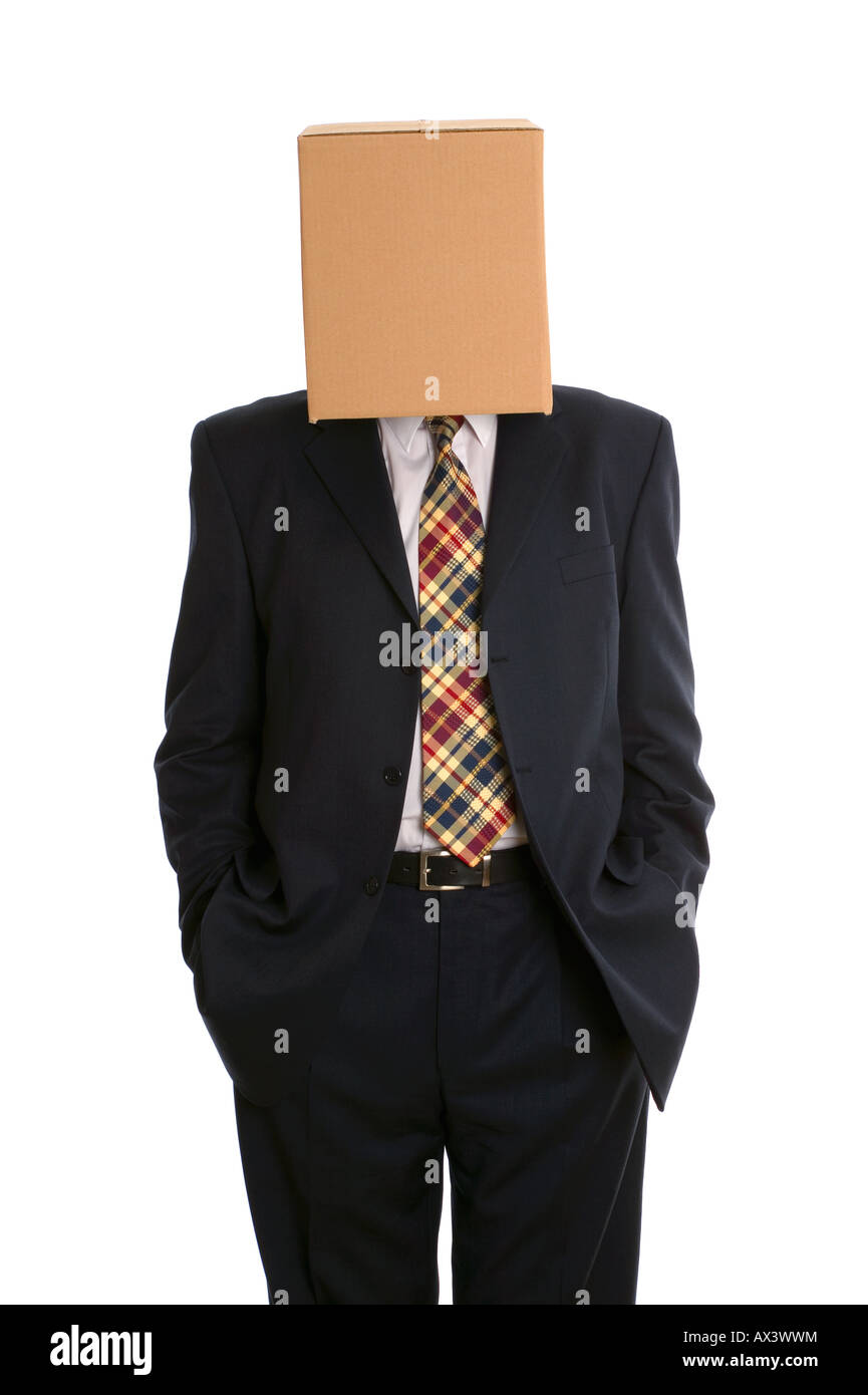 An anonymous businessman with a box on his head and hands in pockets Stock Photo