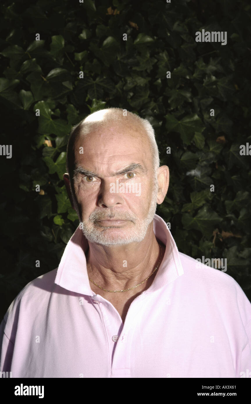 Man in pink shirt hi-res stock photography and images - Alamy