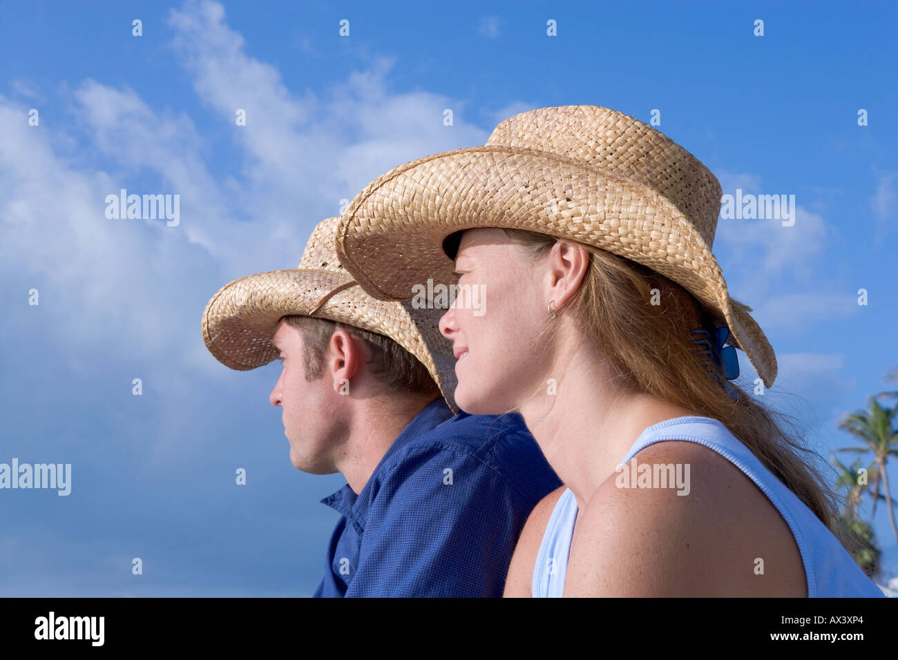 Man and woman wearing straw cowboy hats in Key West Florida USA Model