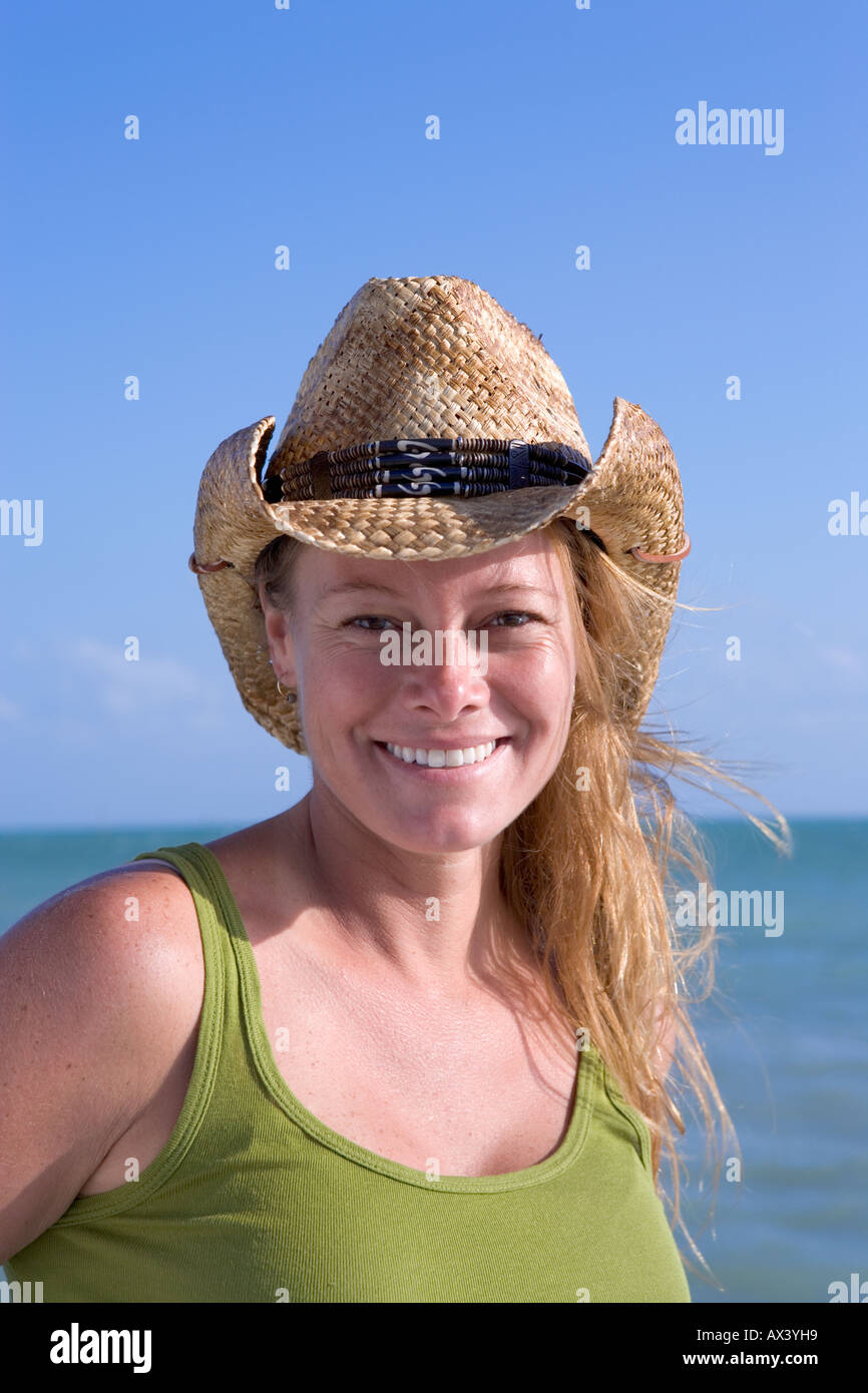 One blond woman wearing straw cowboy hat in Key West, Florida, USA