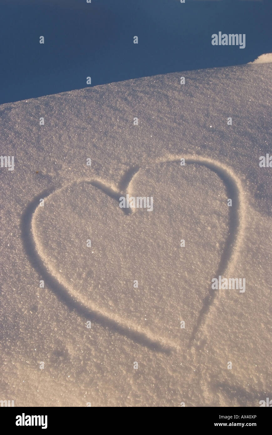 A heart drawn in powdery snow Stock Photo - Alamy