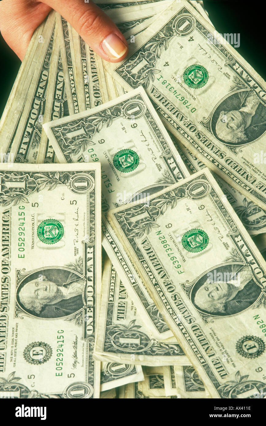 handful of one dollar bills US Stock Photo