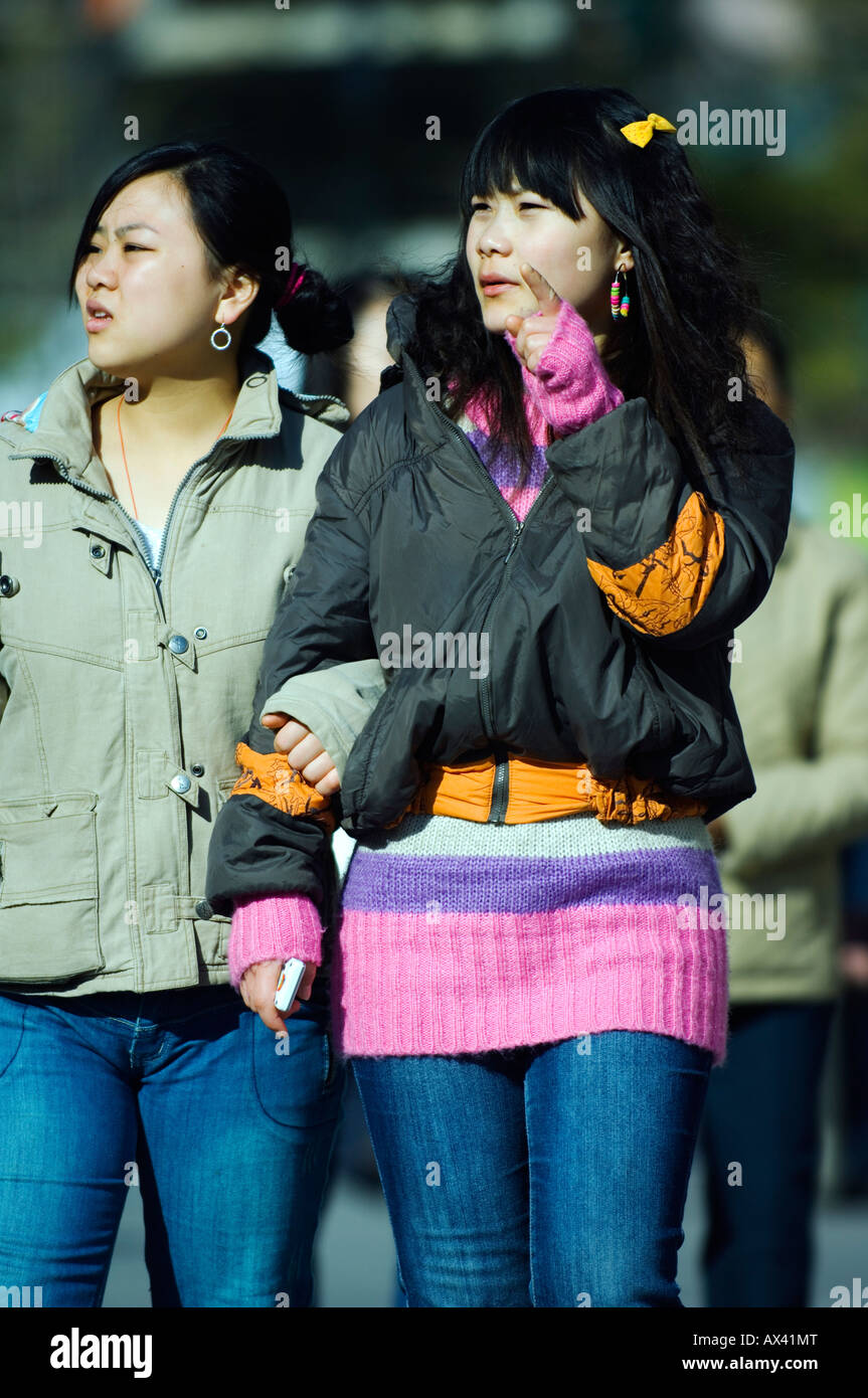China, Beijing. Chinese girls walking on Wanfujing Shopping street. Stock Photo