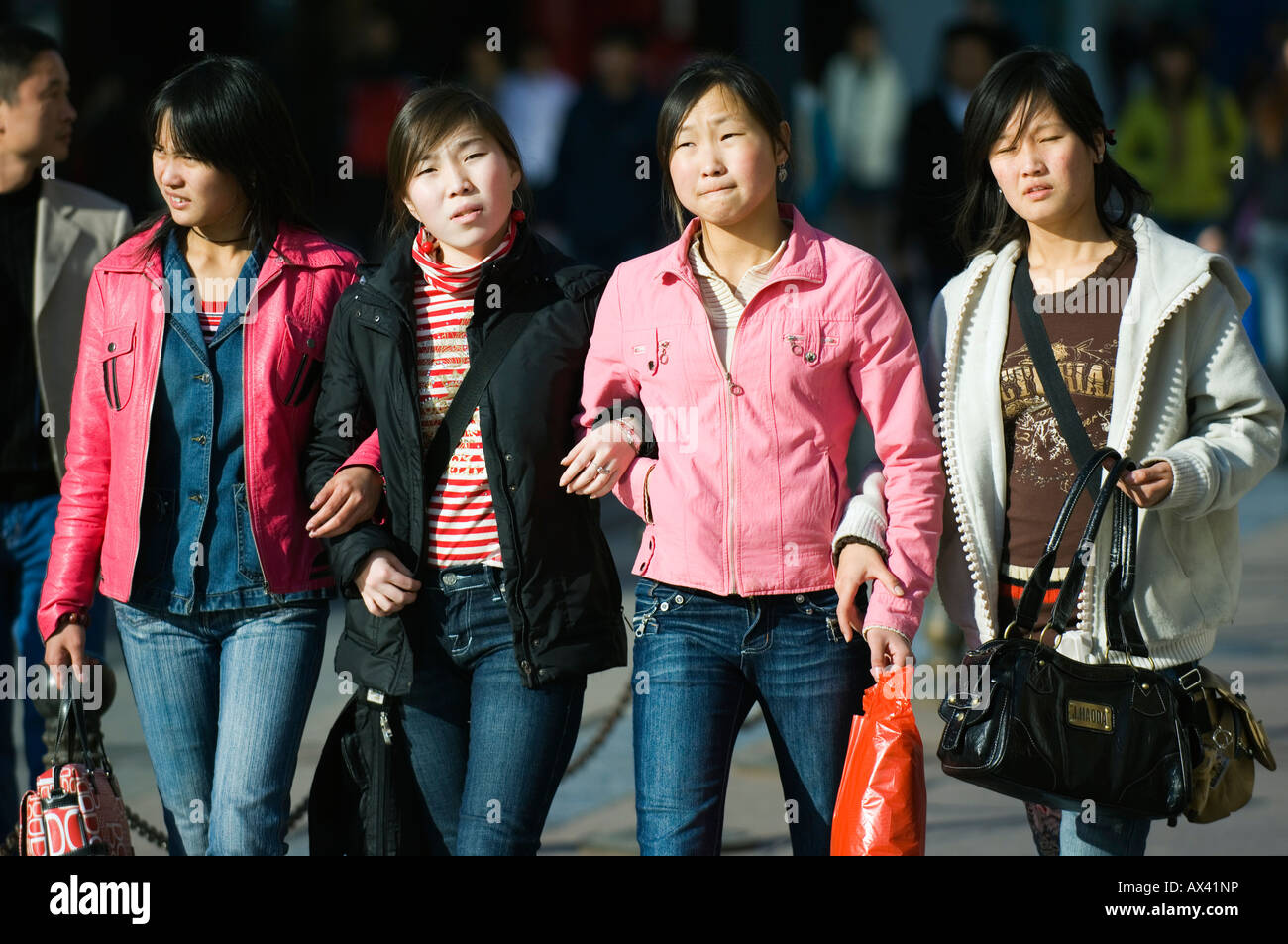 China, Beijing. Chinese girls walking on Wanfujing Shopping street. Stock Photo