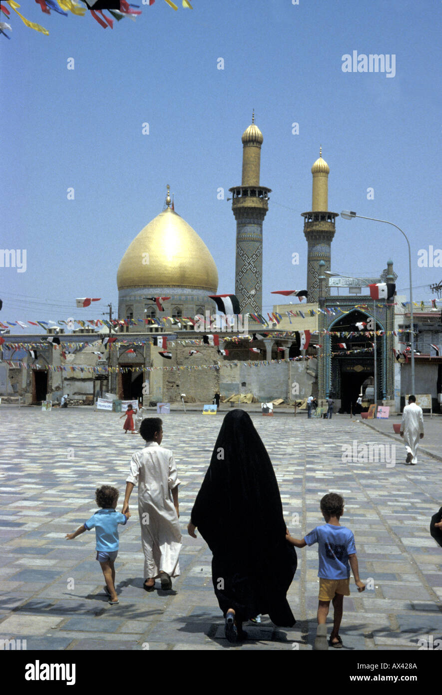 The Al-Abbas Shrine is the mausoleum of Abbas ibn Ali and a mosque, located near the Imam Husayn Mosque in Karbala, Iraq Stock Photo