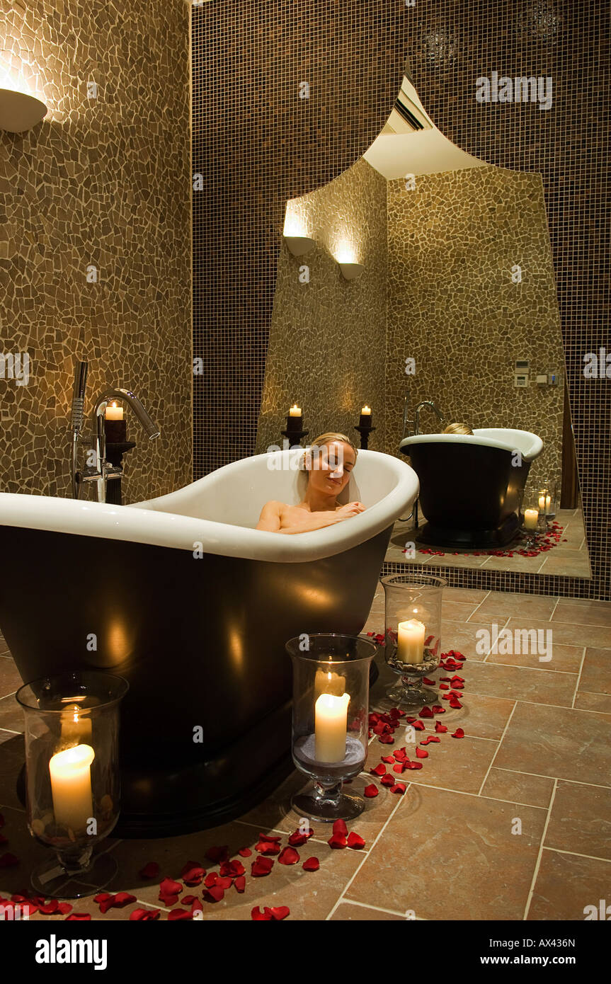 Northern Ireland, Fermanagh, Enniskillen. A woman enjoys a hot soak in