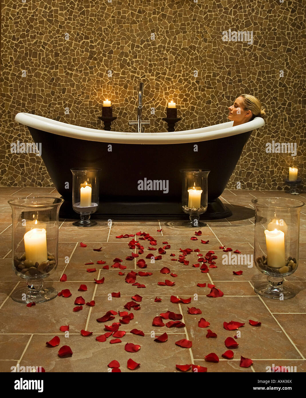 Northern Ireland, Fermanagh, Enniskillen. A woman enjoys a hot soak in