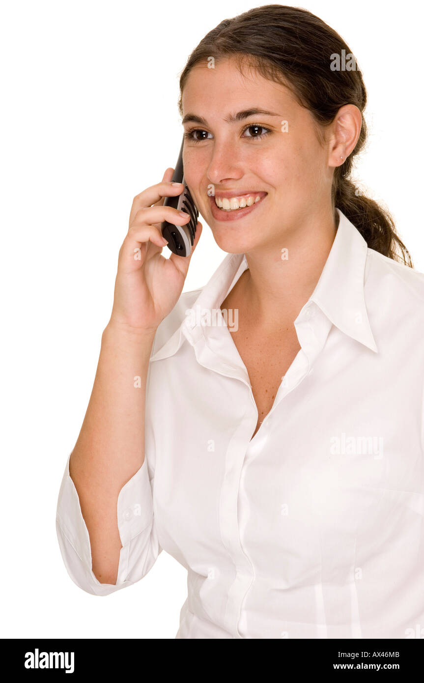 A young businesswoman smiles as she listens to someone talking on a