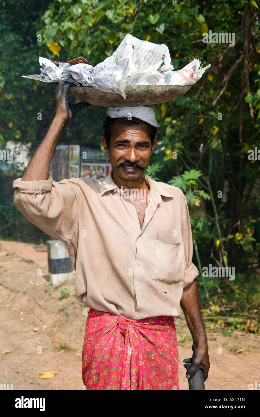 Man carrying large tray on his head, Kerala, India Stock Photo Alamy