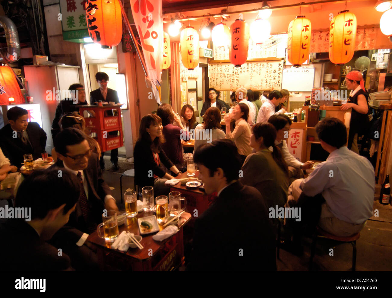 Small restaurant under the railway tracks at Yurakucho in central Tokyo Japan Stock Photo