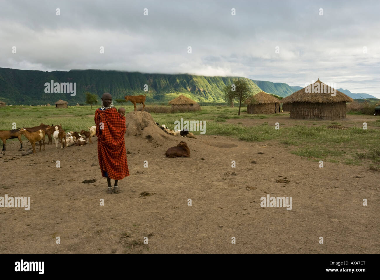 Maasai female and baby stand proud over their village and tribe in the Crater Highlands of Tanzania and Kenya Stock Photo